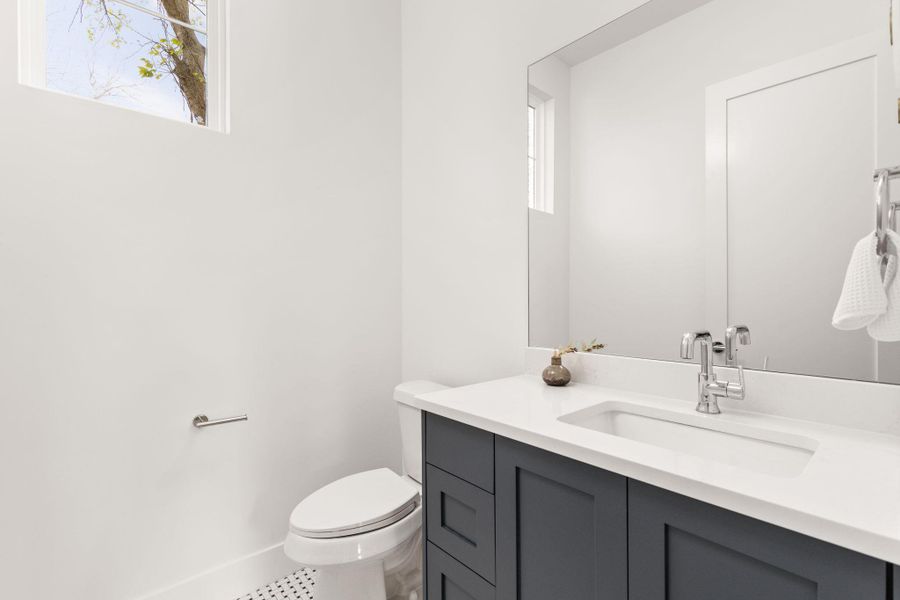 Bathroom featuring vanity and toilet Bathroom featuring vanity and toilet