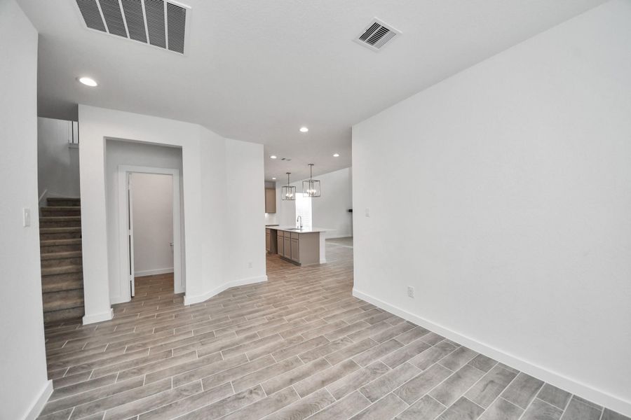Make memories gathered around the table with your family and friends! This spacious dining room features elegant flooring, custom paint, and adjacent to family room and kitchen for open concept feel. Make memories gathered around the table with your family and friends! This spacious dining room features elegant flooring, custom paint, and adjacent to family room and kitchen for open concept feel.