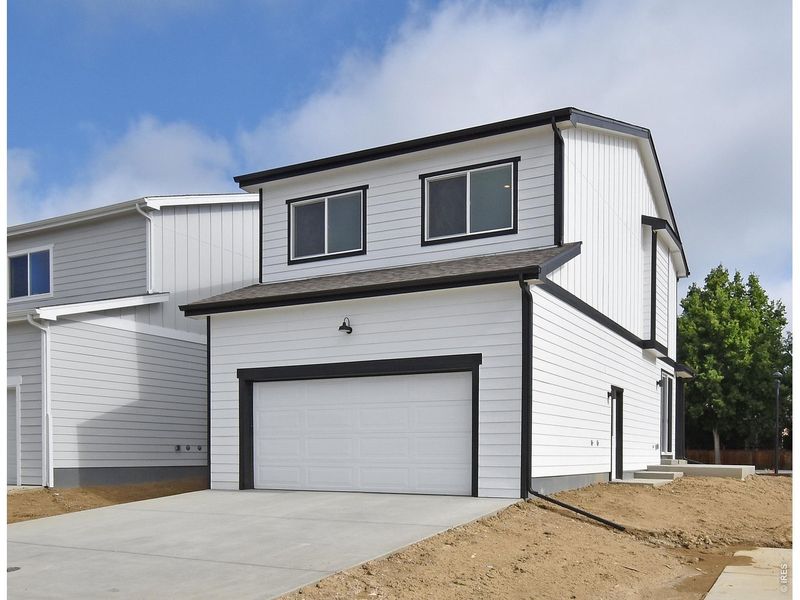 Front exterior of a new home in , Berthoud, CO, highlighting curb appeal (Image 22).