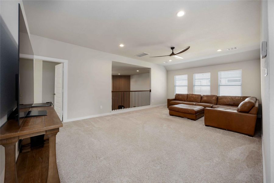 Spacious upstairs game room overlooking the main living area for an open, connected feel. Spacious upstairs game room overlooking the main living area for an open, connected feel.