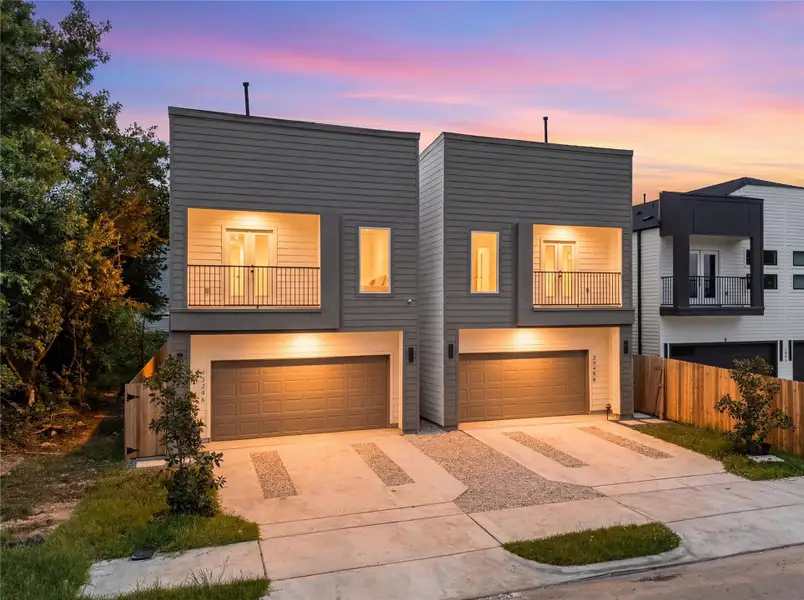 Modern facade at dusk — bold rooflines and exterior lighting that set the tone Modern facade at dusk — bold rooflines and exterior lighting that set the tone