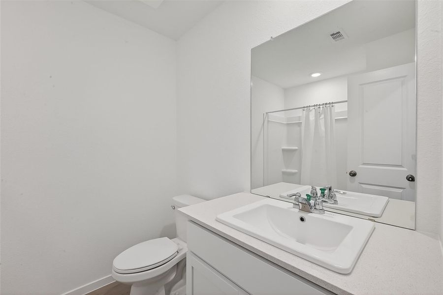 The guest bath is located between the secondary bedrooms.