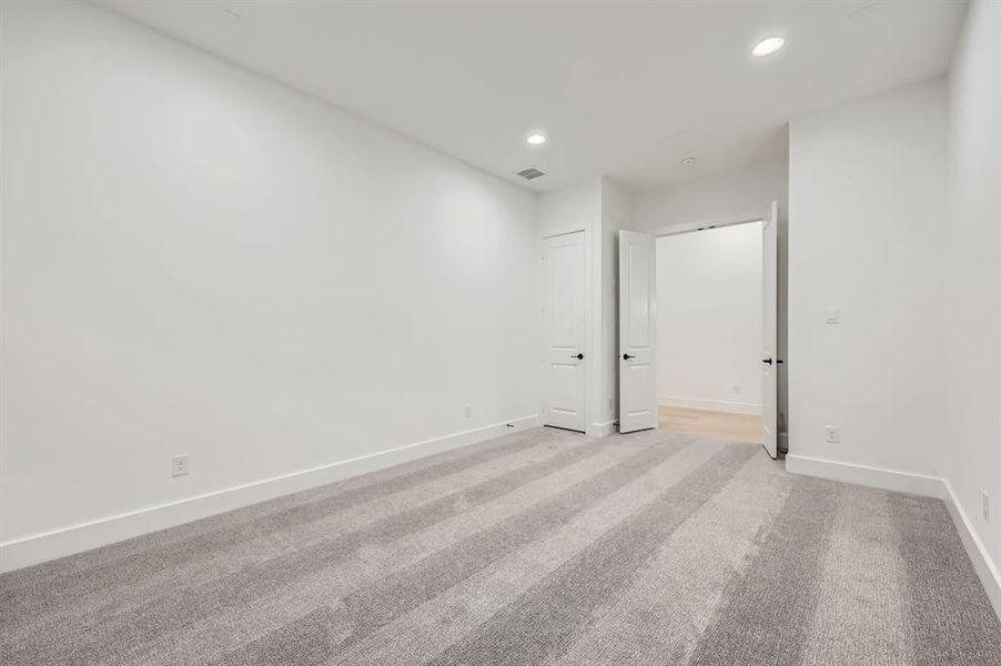 Spare room featuring light colored carpet