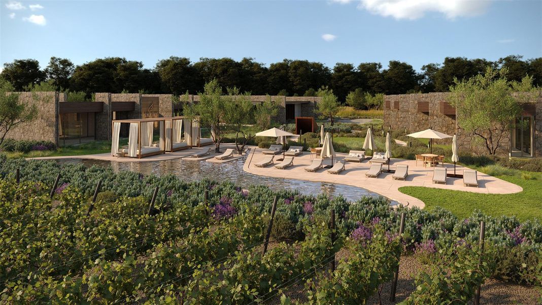 Outdoor recreational area featuring multiple courts, natural stone architectural elements, mature trees, landscaped planting beds, and paved pathways with integrated lighting