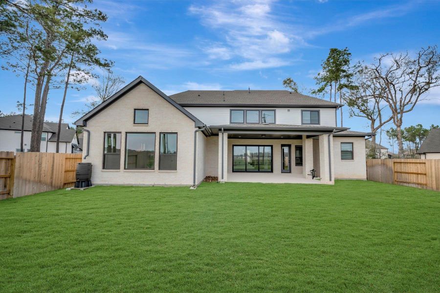 Exterior details and patio area of a home in ARTAVIA 65' Homesites, Conroe (Image 26).