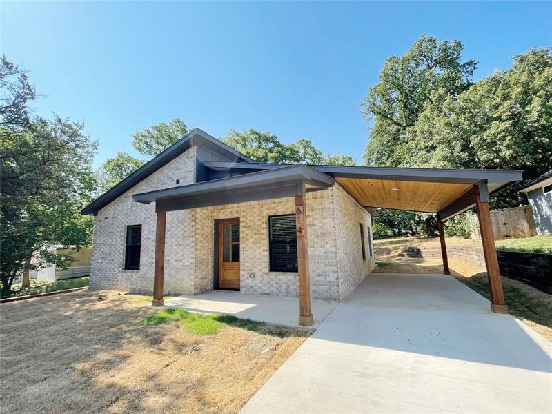 View of front of home featuring a carport