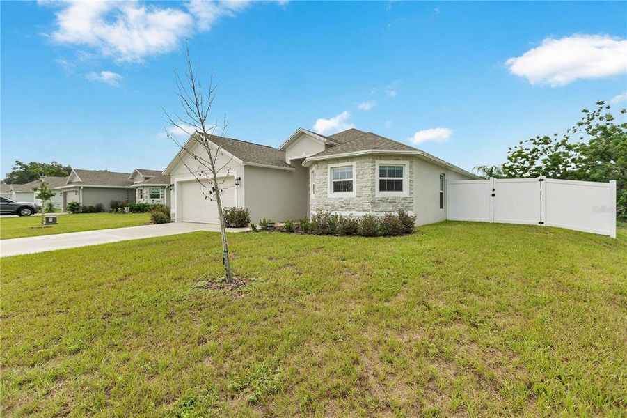 Front exterior of a new home in Sand Lake Groves, Bartow, FL, highlighting curb appeal (Image 2). Front exterior of a new home in Sand Lake Groves, Bartow, FL, highlighting curb appeal (Image 2).