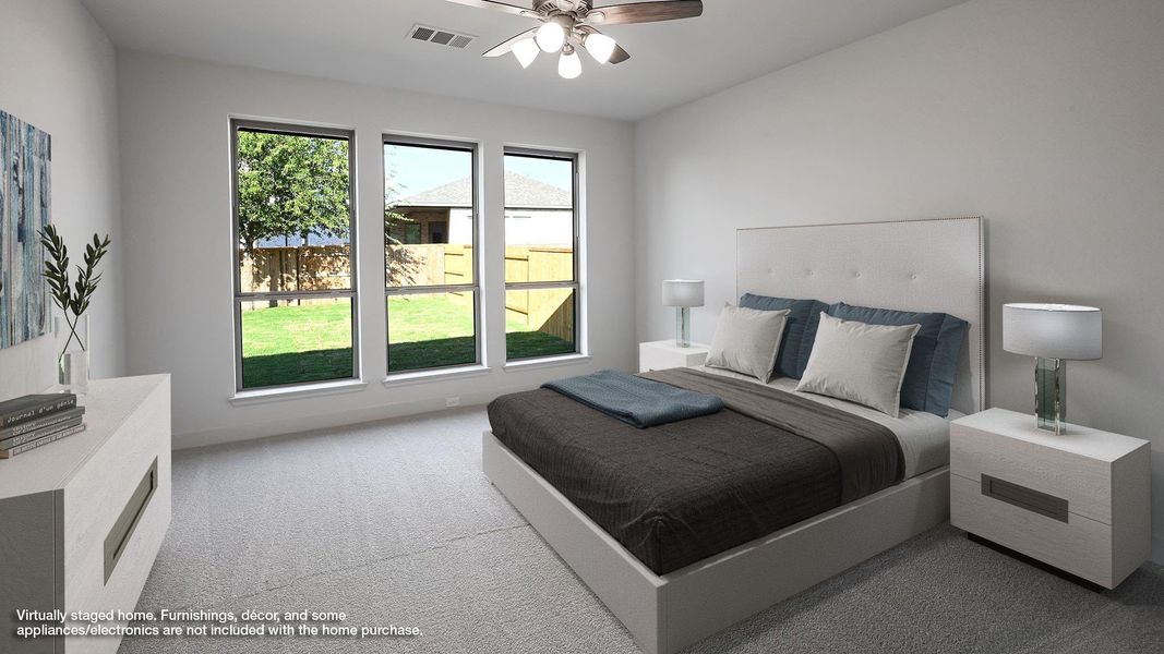 Bedroom featuring carpet floors and ceiling fan Bedroom featuring carpet floors and ceiling fan