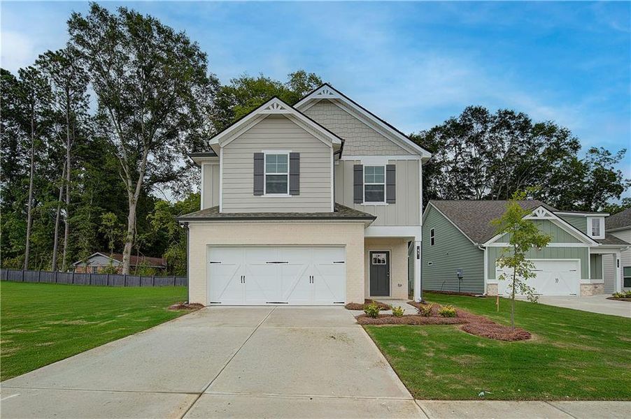 Front exterior of a home in the Enclave at Evergreen community, located in Fairburn, GA (Image 12). Front exterior of a home in the Enclave at Evergreen community, located in Fairburn, GA (Image 12).
