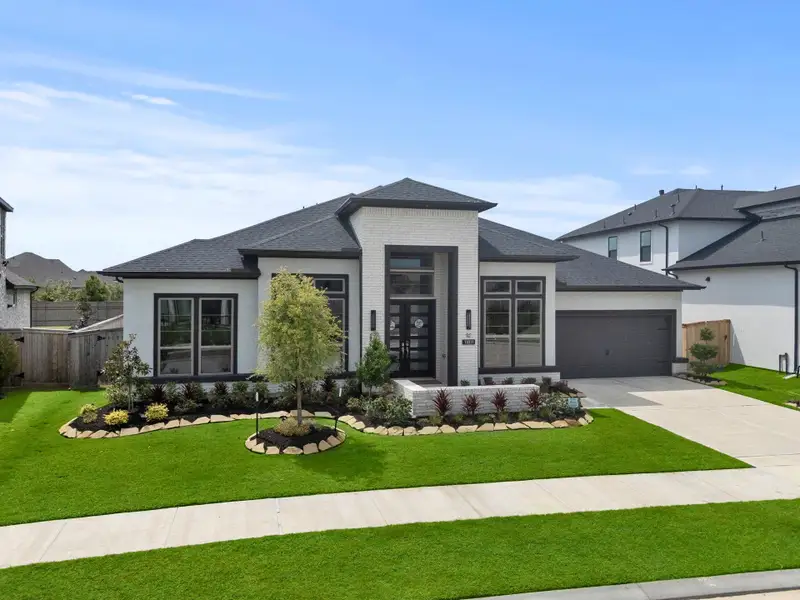 Front exterior of a new home in , Cypress, TX, highlighting curb appeal (Image 1).