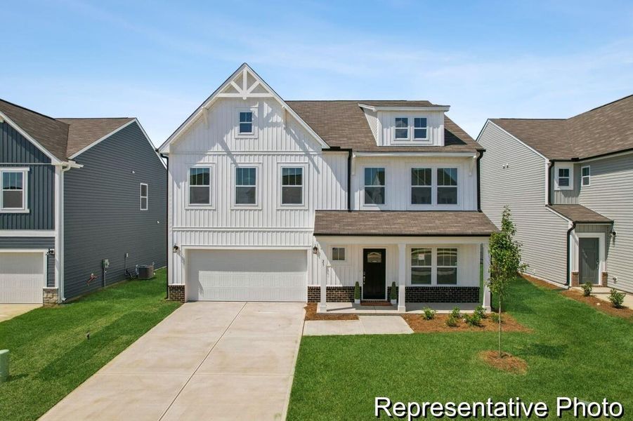Front exterior of a new home in , Ravenel, SC, highlighting curb appeal (Image 1). Front exterior of a new home in , Ravenel, SC, highlighting curb appeal (Image 1).