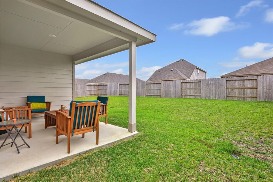 Exterior details and patio area of a home in Pinewood at Grand Texas, New Caney (Image 3).