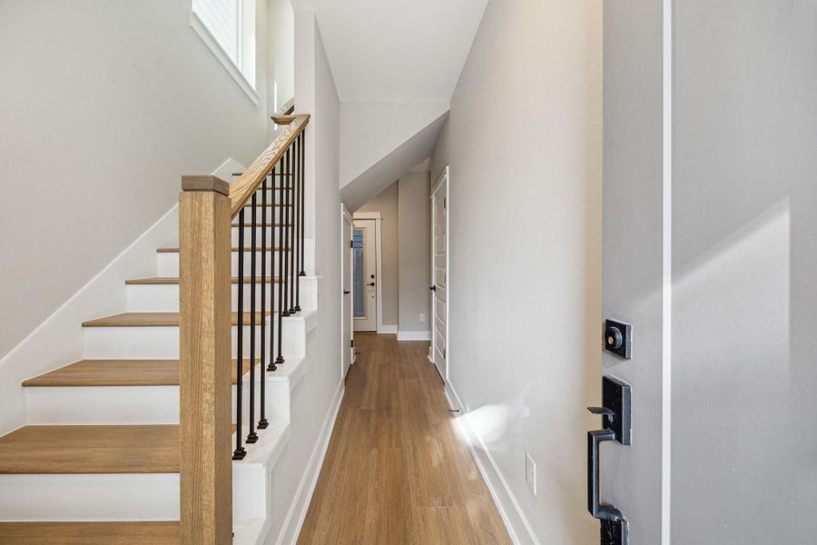 Entry hallway with large storage closet under stairs Entry hallway with large storage closet under stairs