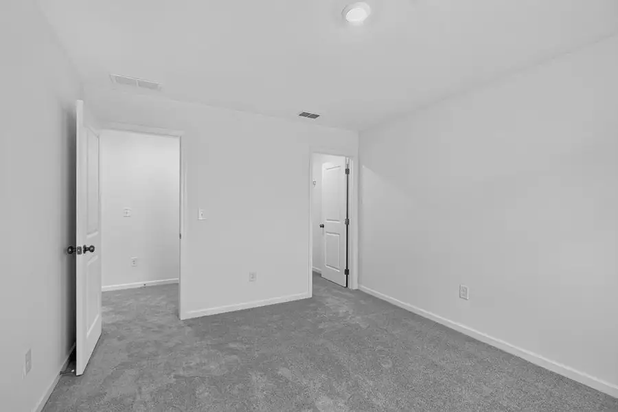 Spacious, unfurnished interior of a new home in Weatherfield, Buford (Image 36).