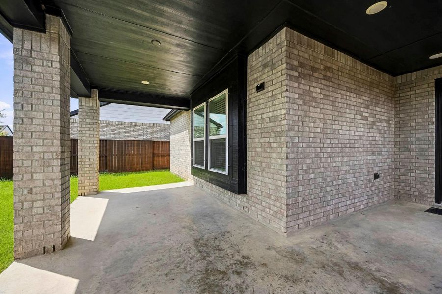 Exterior details and patio area of a home in Meridiana, Iowa Colony (Image 3).