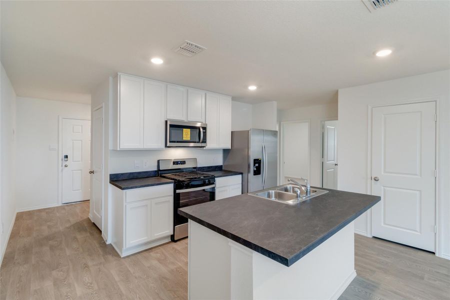 Furnished interior view inside a new home in Watermill, Uhland (Image 8).