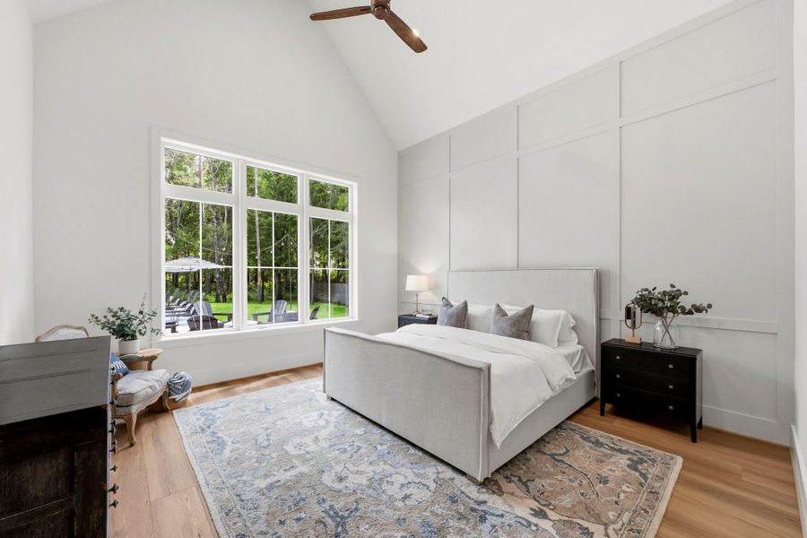 Spacious primary suite with cathedral vaulted ceilings and custom trim. Spacious primary suite with cathedral vaulted ceilings and custom trim.