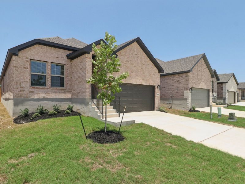 Front exterior of a new home in Kallison Ranch, San Antonio, TX, highlighting curb appeal (Image 22).