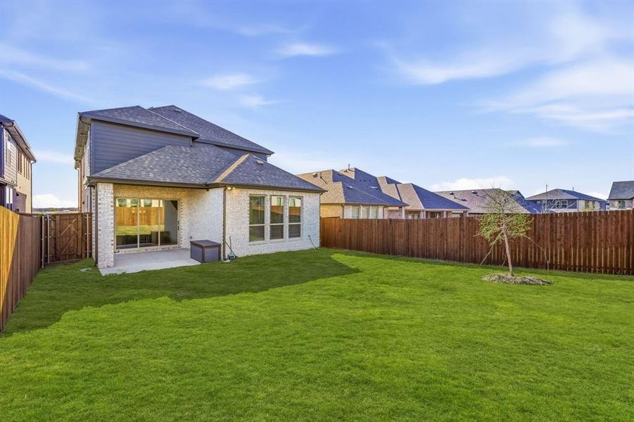 Exterior details and patio area of a home in The Villages of Hurricane Creek, Anna (Image 23).