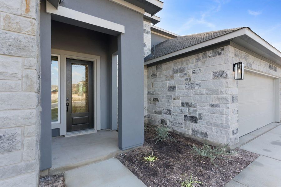 Exterior details and patio area of a home in Lariat, Liberty Hill (Image 4).