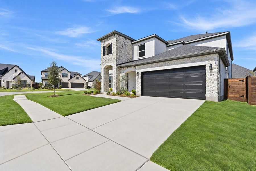 Front exterior of a new home in The Ridge at Northlake, Northlake, TX, highlighting curb appeal (Image 20).