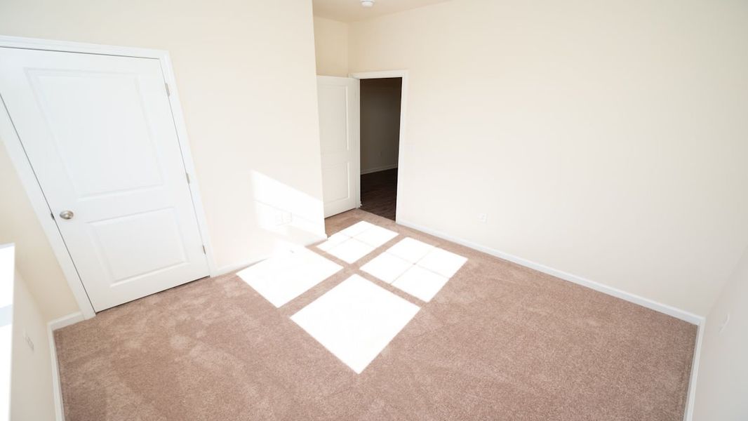 Representative unfurnished interior of a home built from the CALI by D.R. Horton in The Reserve at Wild Horse, Conway (Image 14).
