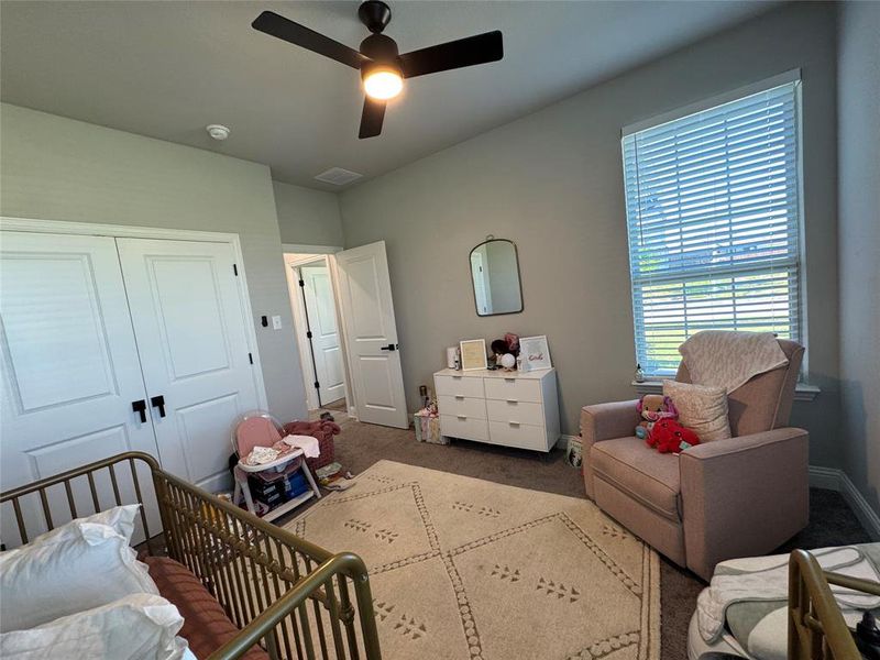 Bedroom featuring a closet, carpet floors, and ceiling fan Bedroom featuring a closet, carpet floors, and ceiling fan