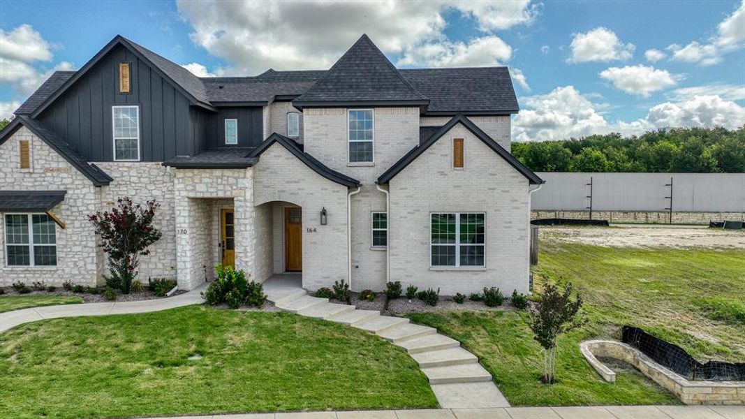 Front exterior of a new home in , Aledo, TX, highlighting curb appeal (Image 24).