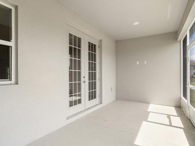 Your interior opens to outdoor living space on a large covered lanai - Willow II with Loft by Highland Homes Your interior opens to outdoor living space on a large covered lanai - Willow II with Loft by Highland Homes