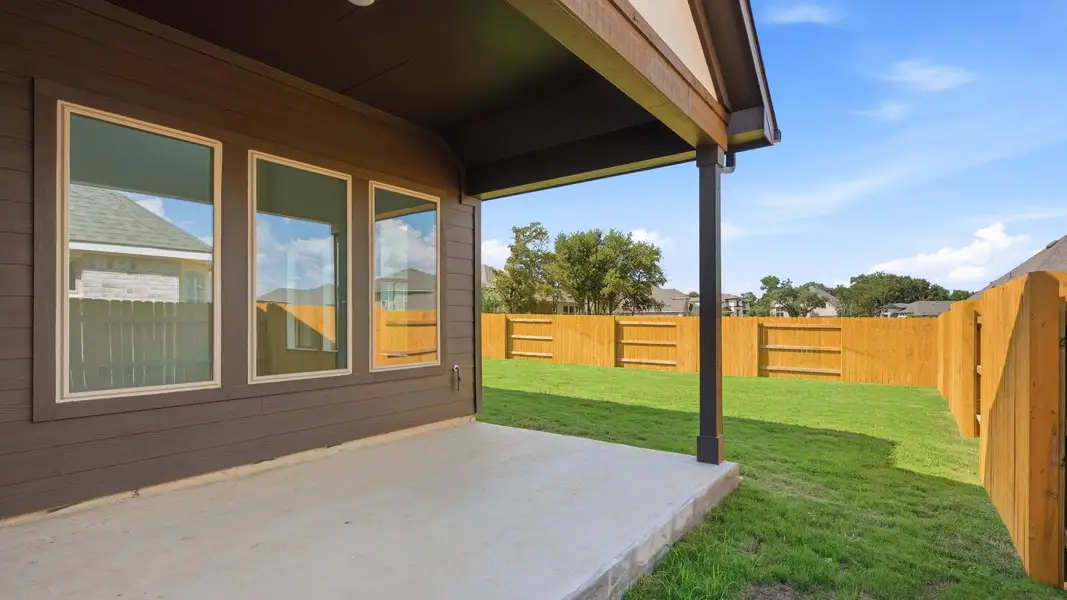 Exterior details and patio area of a home in Oaks at San Gabriel, Georgetown (Image 3).