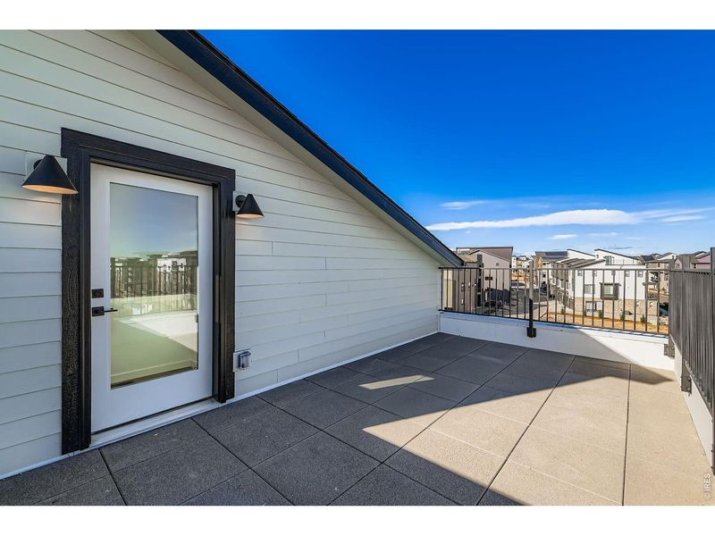 Exterior details and patio area of a home in Parkside West at Baseline, Broomfield (Image 24).