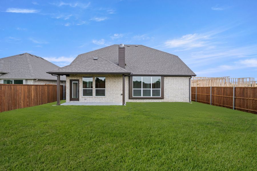 Exterior details and patio area of a home in Meadow Park at The Meadows, Ponder (Image 4).