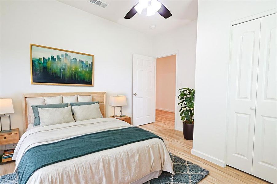 Bedroom featuring light wood-style flooring and ceiling fan
