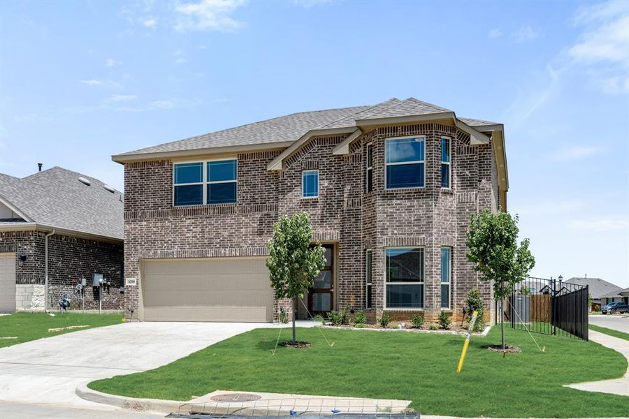 Front exterior of a new home in Godley Ranch Elements, Godley, TX, highlighting curb appeal (Image 21). Front exterior of a new home in Godley Ranch Elements, Godley, TX, highlighting curb appeal (Image 21).