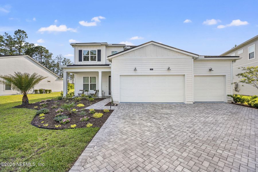 Front exterior of a new home in , St. Johns, FL, highlighting curb appeal (Image 21). Front exterior of a new home in , St. Johns, FL, highlighting curb appeal (Image 21).