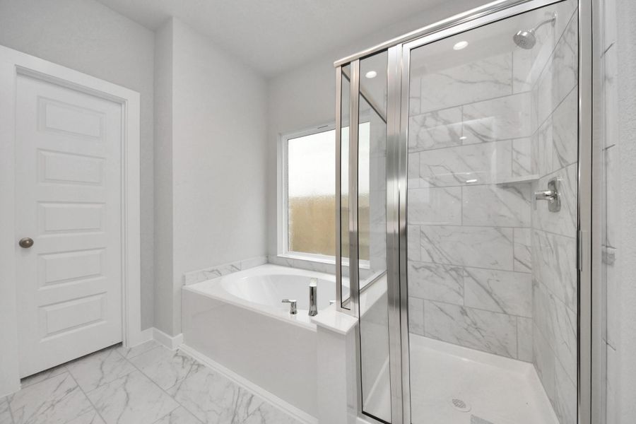 Indulge in a spa-like retreat within the confines of this primary bathroom.