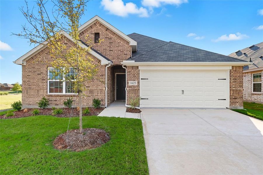 View of front of home with driveway, brick siding, a shingled roof, and a front lawn View of front of home with driveway, brick siding, a shingled roof, and a front lawn