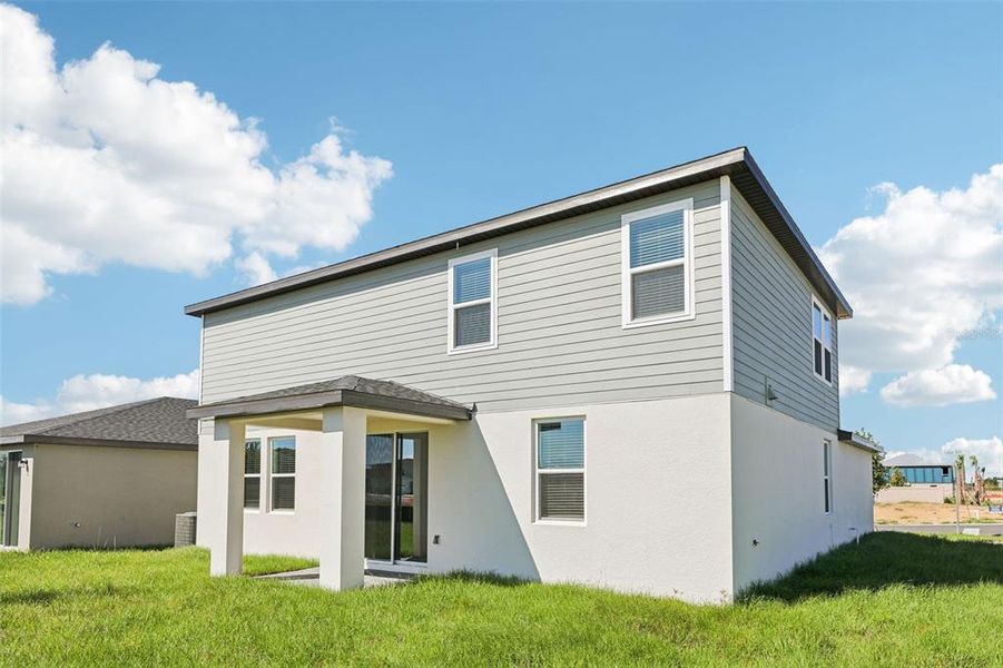 Exterior details and patio area of a home in Crosswinds - Signature Series, Haines City (Image 26).