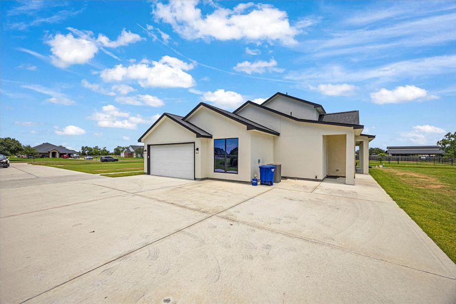 Front exterior of a new home in , Baytown, TX, highlighting curb appeal (Image 21).