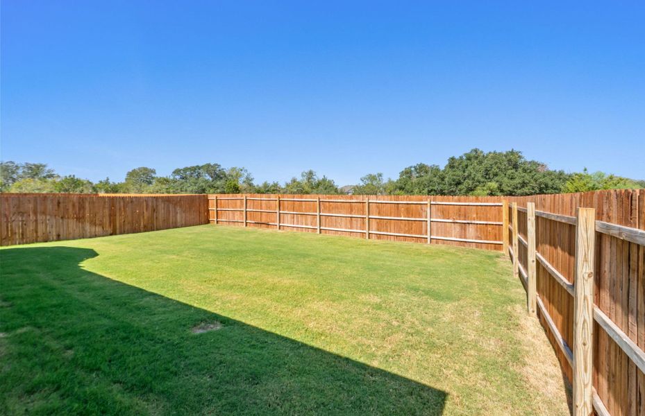 Exterior details and patio area of a home in Saddleback at Santa Rita Ranch, Liberty Hill (Image 26). Exterior details and patio area of a home in Saddleback at Santa Rita Ranch, Liberty Hill (Image 26).