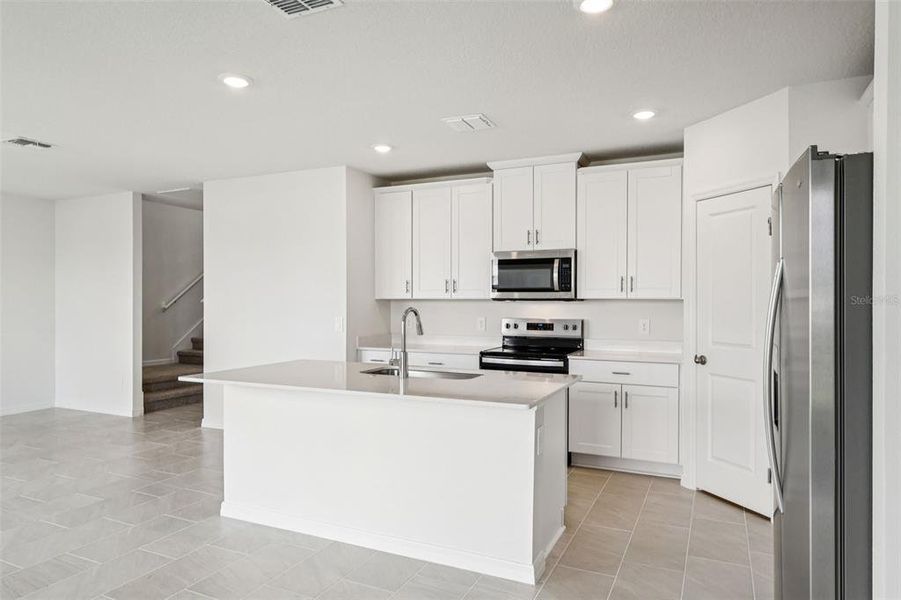 Furnished interior view inside a new home in Crosswinds - Classic Series, Haines City (Image 12). Furnished interior view inside a new home in Crosswinds - Classic Series, Haines City (Image 12).