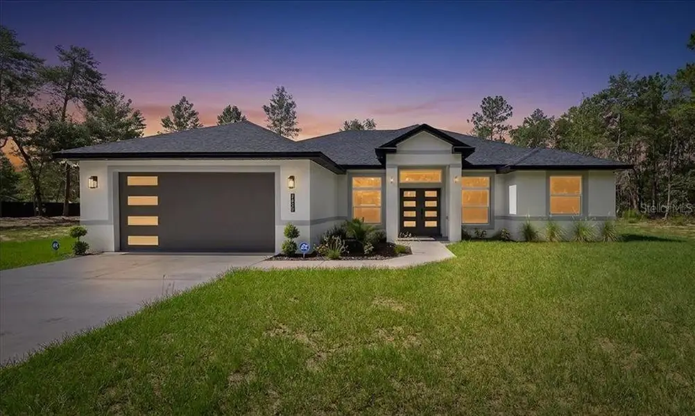 Front exterior of a new home in , Ocala, FL, highlighting curb appeal (Image 2). Front exterior of a new home in , Ocala, FL, highlighting curb appeal (Image 2).