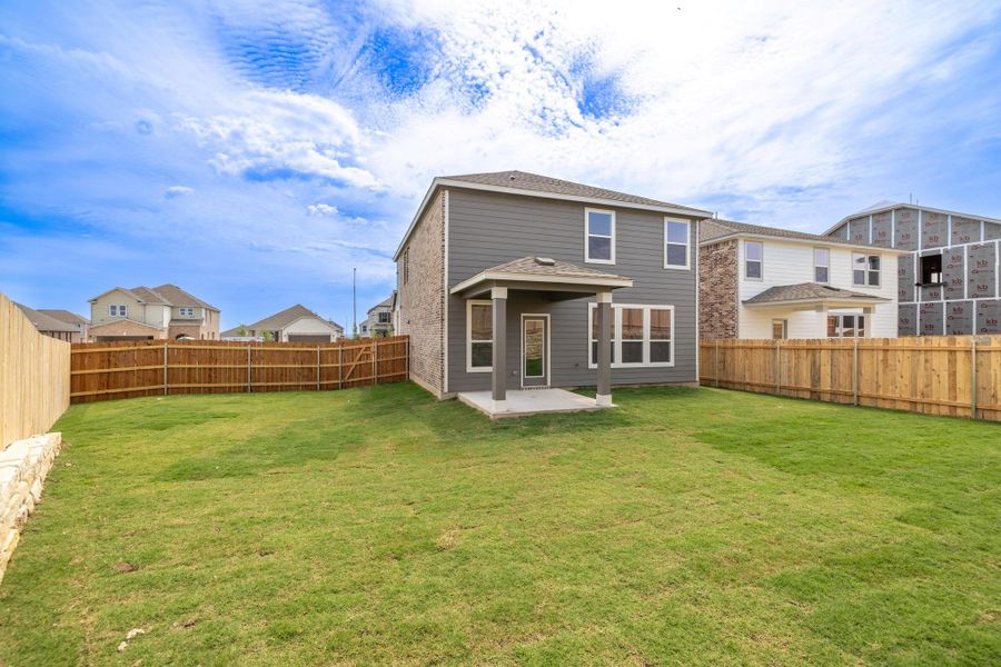 Front exterior of a new home in Salerno - Heritage Collection, Round Rock, TX, highlighting curb appeal (Image 21). Front exterior of a new home in Salerno - Heritage Collection, Round Rock, TX, highlighting curb appeal (Image 21).