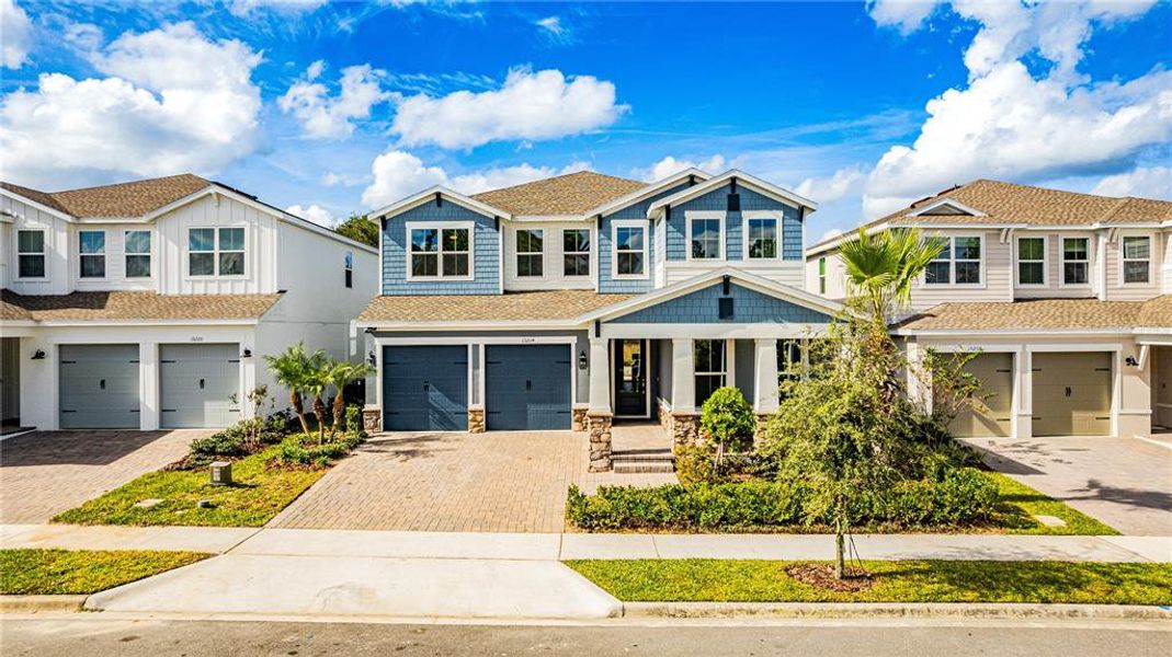Front exterior of a new home in , Winter Garden, FL, highlighting curb appeal (Image 29). Front exterior of a new home in , Winter Garden, FL, highlighting curb appeal (Image 29).
