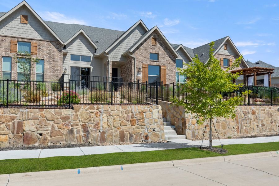 Front exterior of a new home in Cottonwood Creek, Rowlett, TX, highlighting curb appeal (Image 23).