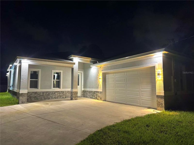 Front exterior of a new home in , Palm Coast, FL, highlighting curb appeal (Image 17).