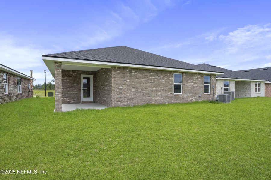 Front exterior of a new home in Shadow Crest at Rolling Hills, Green Cove Springs, FL, highlighting curb appeal (Image 2).