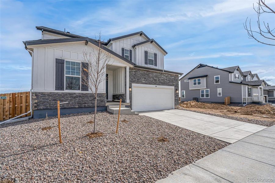 Front exterior of a new home in , Commerce City, CO, highlighting curb appeal (Image 20).