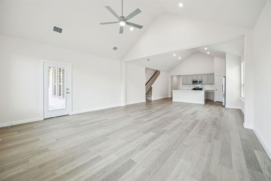 Living Room in the Claret home plan by Trophy Signature Homes  REPRESENTATIVE PHOTO