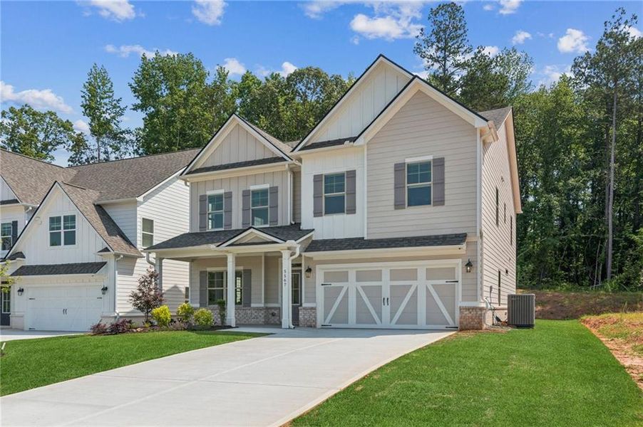 Front exterior of a new home in , Flowery Branch, GA, highlighting curb appeal (Image 2).
